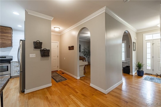1635 Dorset Meadows Ln, Powhatan, VA 23139 - entrance foyer with light wood-type flooring, arched walkways, crown molding, and recessed lighting