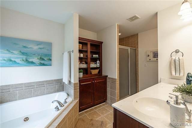 1635 Dorset Meadows Ln, Powhatan, VA 23139 - full bathroom featuring double vanity, a bath, a stall shower, and tile patterned floors