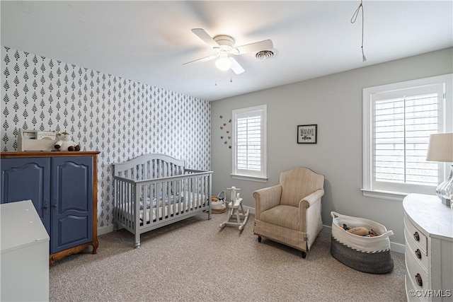 1635 Dorset Meadows Ln, Powhatan, VA 23139 - bedroom featuring wallpapered walls, a nursery area, carpet, ceiling fan, and an accent wall