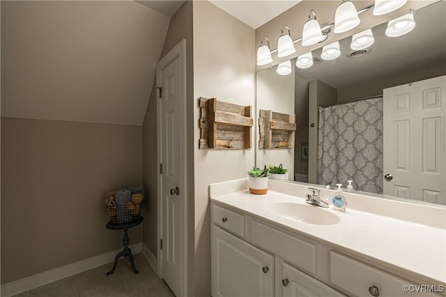 1635 Dorset Meadows Ln, Powhatan, VA 23139 - bathroom featuring vanity, tile patterned flooring, and vaulted ceiling