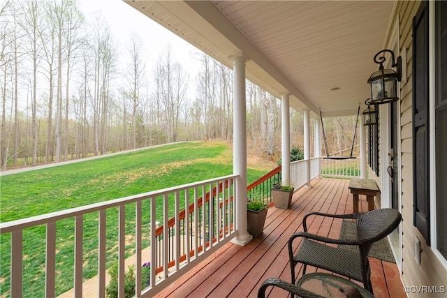 1635 Dorset Meadows Ln, Powhatan, VA 23139 - wooden porch featuring a lawn and a forest view