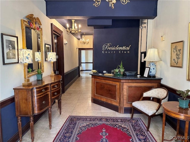 welcome area featuring a notable chandelier