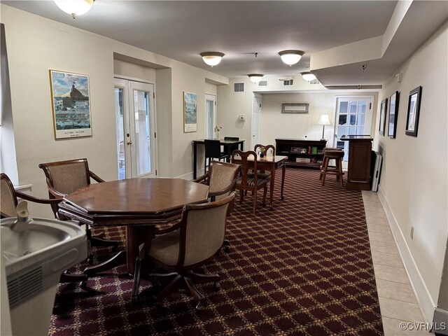 dining room with visible vents and baseboards