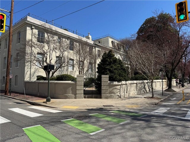 view of property with fence