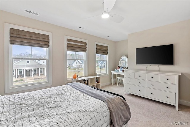 703 W Vaughan Rd, Hanover, VA 23005 - bedroom featuring multiple windows, light colored carpet, and ceiling fan