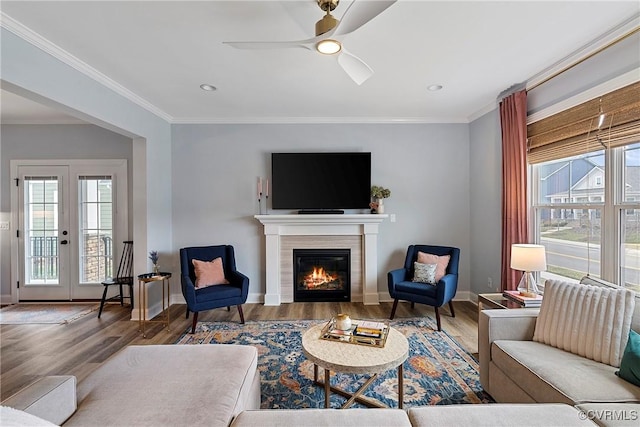 703 W Vaughan Rd, Hanover, VA 23005 - living room with healthy amount of natural light, a fireplace, ornamental molding, wood finished floors, and ceiling fan