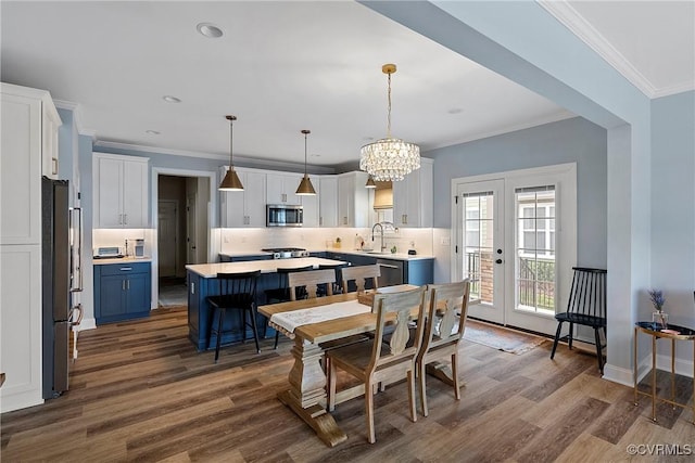 703 W Vaughan Rd, Hanover, VA 23005 - dining space featuring dark wood-type flooring, a chandelier, crown molding, french doors, and recessed lighting