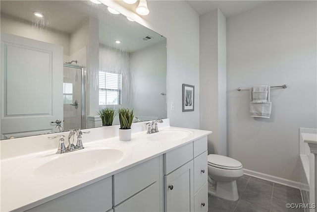6328 Gossamer Aly, Moseley, VA 23120 - bathroom featuring double vanity, a stall shower, toilet, visible vents, and a sink