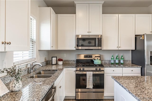 6328 Gossamer Aly, Moseley, VA 23120 - kitchen with white cabinets, a sink, light stone counters, and appliances with stainless steel finishes