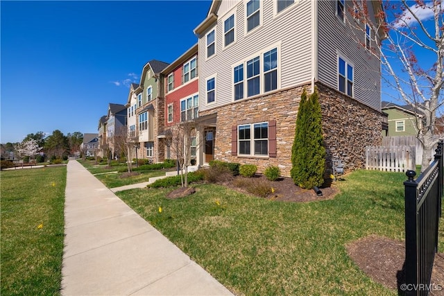 6328 Gossamer Aly, Moseley, VA 23120 - view of building exterior with fence and a residential view