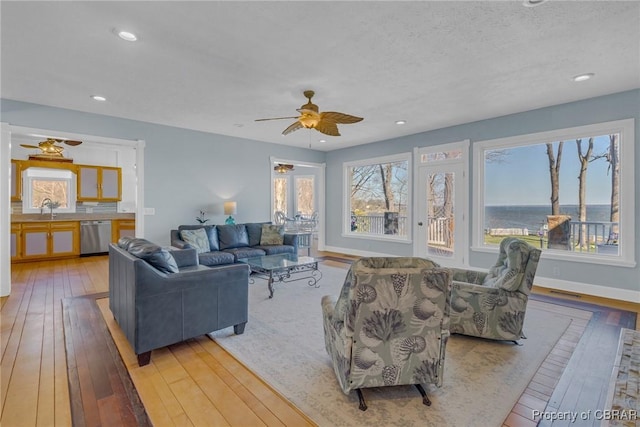 289 Oyster Shell Rd, Laneview, VA 22560 - living room featuring a ceiling fan, wood-type flooring, recessed lighting, a textured ceiling, and baseboards