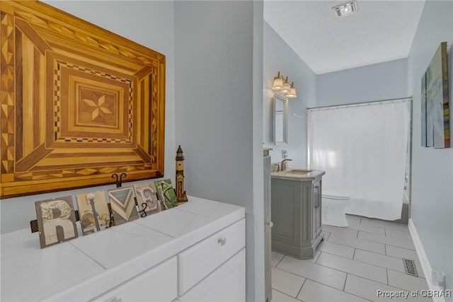 289 Oyster Shell Rd, Laneview, VA 22560 - full bath with toilet, tile patterned flooring, vanity, and baseboards