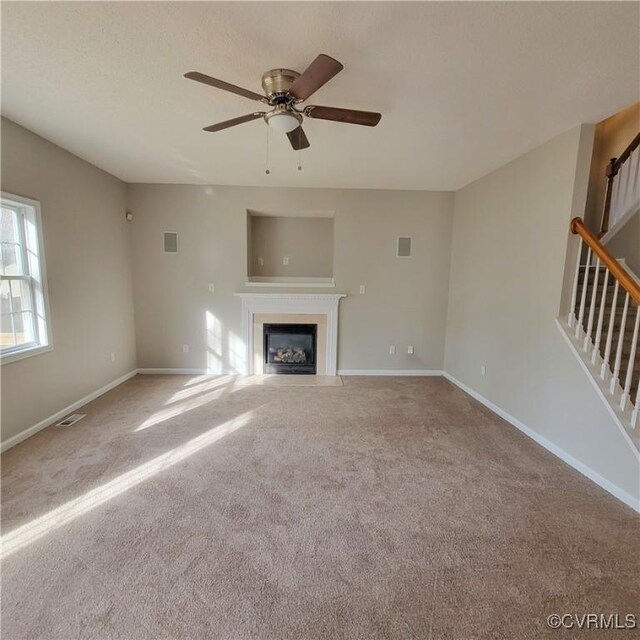 6118 Pond Grass Rd, Mechanicsville, VA 23111 - unfurnished living room with baseboards, stairway, ceiling fan, and visible vents