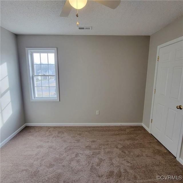 6118 Pond Grass Rd, Mechanicsville, VA 23111 - carpeted empty room with baseboards, a textured ceiling, visible vents, and a ceiling fan
