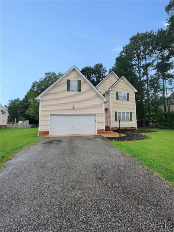 6118 Pond Grass Rd, Mechanicsville, VA 23111 - traditional-style home with a front yard, crawl space, aphalt driveway, and an attached garage