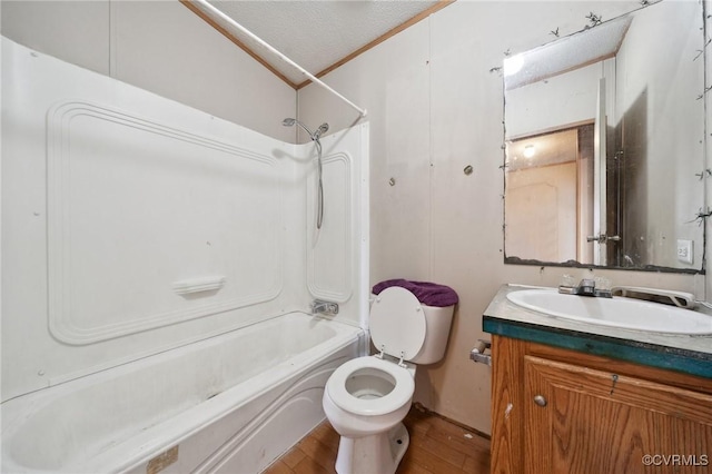 bathroom featuring toilet, vanity, shower / bathing tub combination, wood finished floors, and a textured ceiling