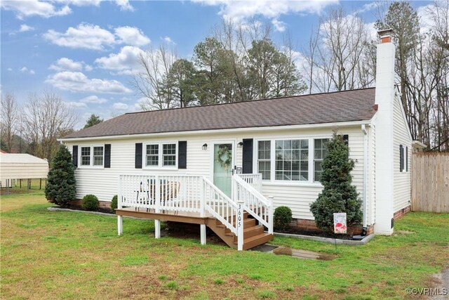 ranch-style house featuring a chimney, roof with shingles, crawl space, and a front yard