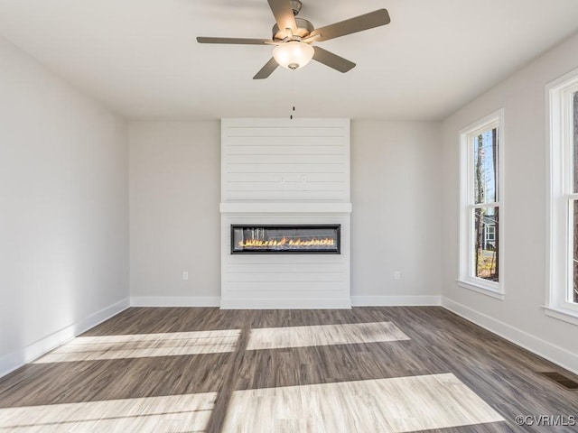 LOT73 Dove Ct, Louisa, VA 23024 - unfurnished living room with visible vents, wood finished floors, a fireplace, baseboards, and ceiling fan