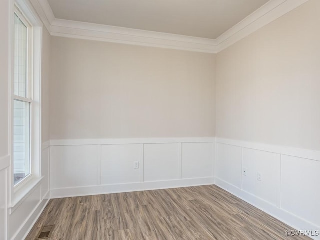 LOT73 Dove Ct, Louisa, VA 23024 - empty room featuring a wainscoted wall, wood finished floors, visible vents, and ornamental molding