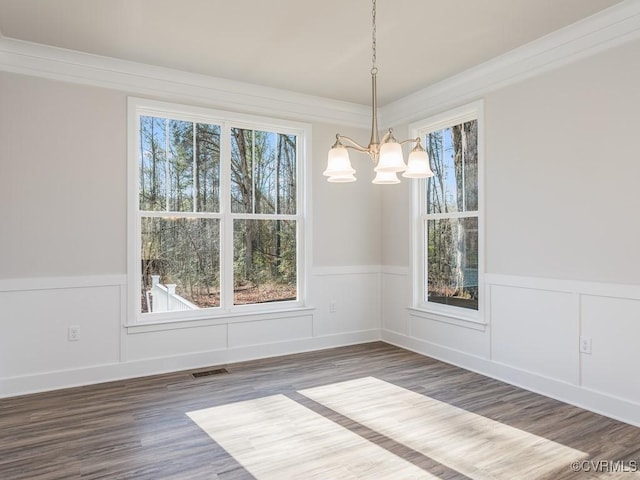 LOT73 Dove Ct, Louisa, VA 23024 - unfurnished dining area with visible vents, wood finished floors, a chandelier, and wainscoting