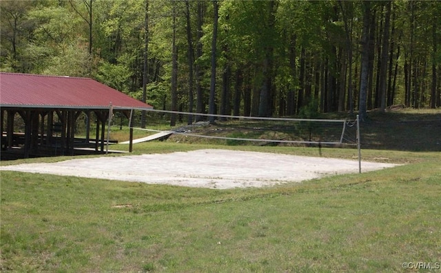 LOT73 Dove Ct, Louisa, VA 23024 - view of community with a lawn, volleyball court, and a view of trees