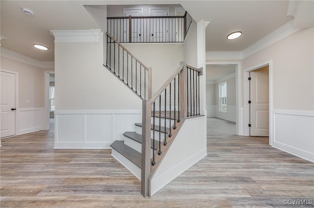 LOT73 Dove Ct, Louisa, VA 23024 - stairway with wainscoting, wood finished floors, and ornamental molding
