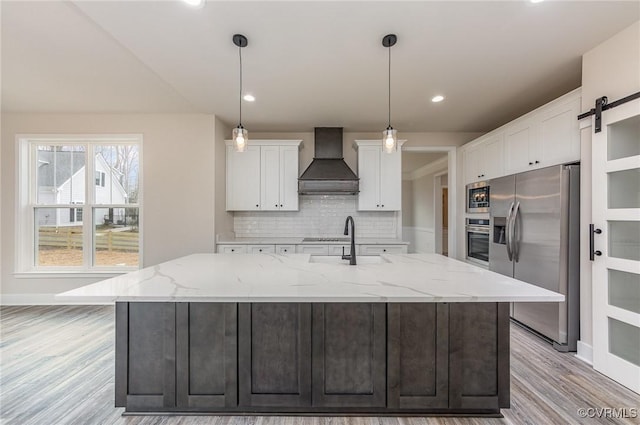 LOT73 Dove Ct, Louisa, VA 23024 - kitchen featuring a sink, tasteful backsplash, white cabinetry, stainless steel appliances, and wall chimney range hood