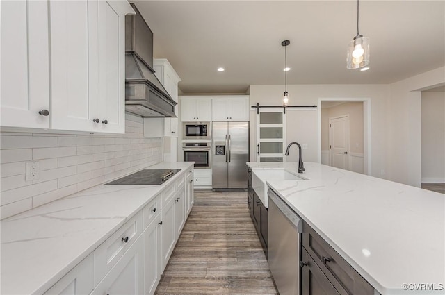 LOT73 Dove Ct, Louisa, VA 23024 - kitchen featuring tasteful backsplash, appliances with stainless steel finishes, wood finished floors, custom exhaust hood, and white cabinetry