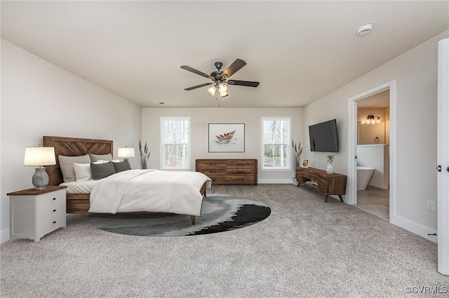 LOT73 Dove Ct, Louisa, VA 23024 - carpeted bedroom with multiple windows, ensuite bath, and baseboards