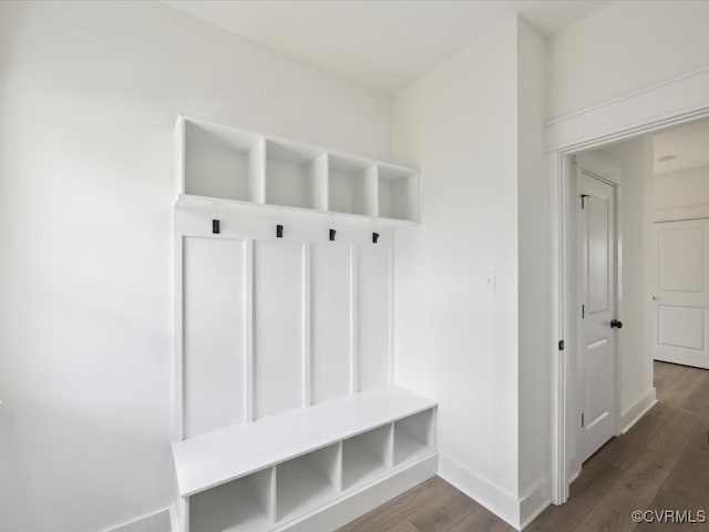mudroom with baseboards and wood finished floors
