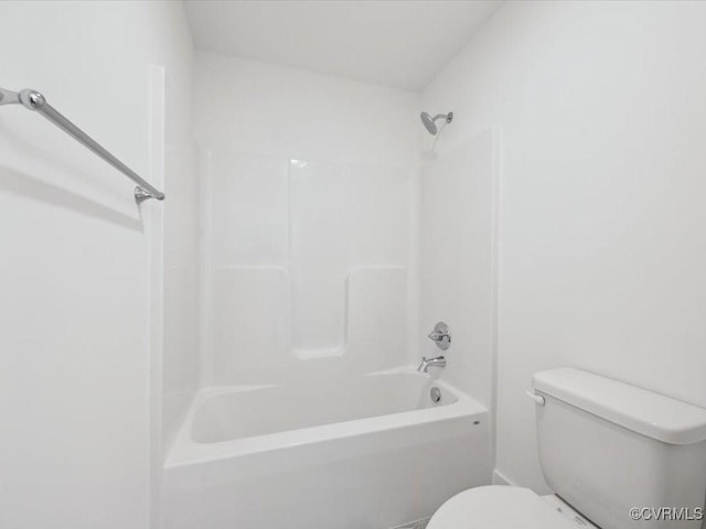 bathroom featuring toilet and bathing tub / shower combination