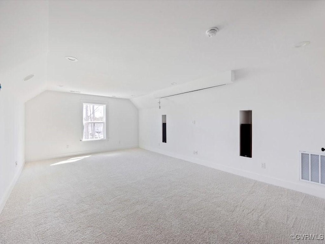 bonus room featuring carpet flooring, vaulted ceiling, and visible vents