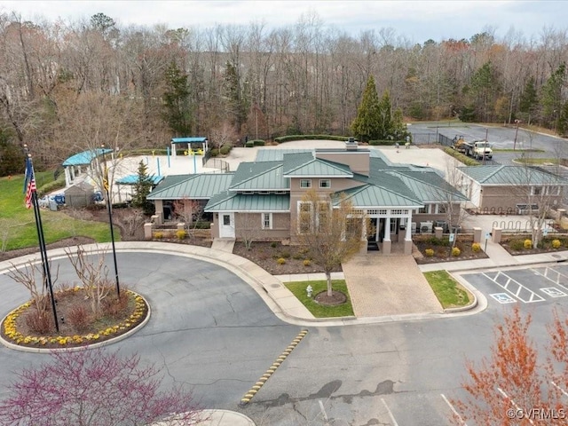 exterior space with a wooded view