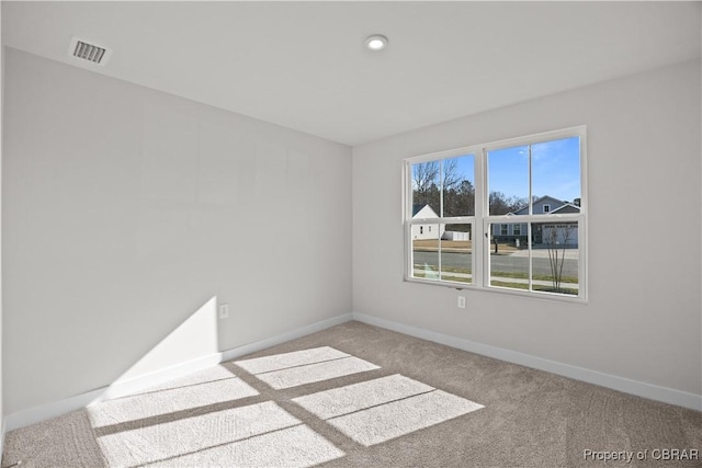 93 Grace Hill Cir, Kilmarnock, VA 22482 - carpeted spare room with baseboards and visible vents