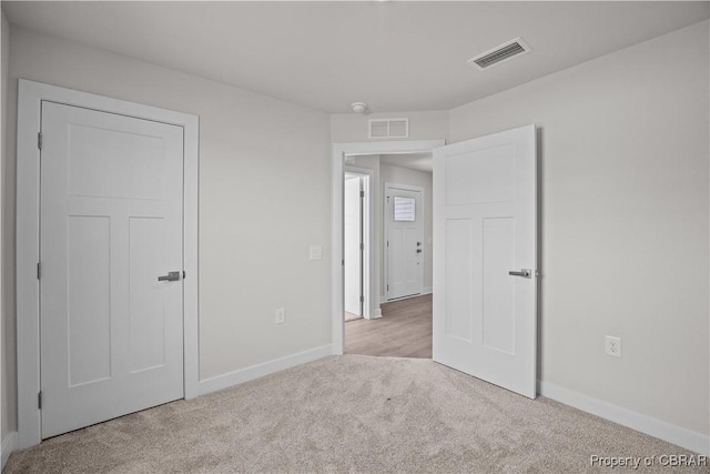 93 Grace Hill Cir, Kilmarnock, VA 22482 - unfurnished bedroom with visible vents, carpet flooring, and baseboards