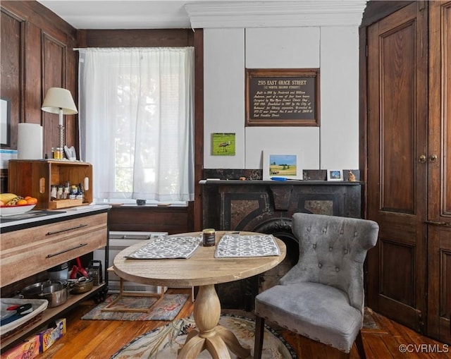 2515 E Grace St, Richmond, VA 23223 - dining space featuring radiator and wood finished floors