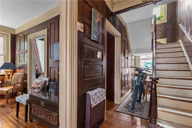 2515 E Grace St, Richmond, VA 23223 - hall with stairs, crown molding, plenty of natural light, and dark wood-style flooring