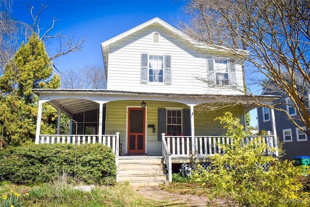 farmhouse featuring covered porch