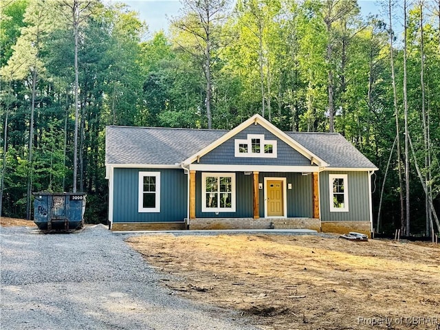 981 Knights Landing Dr, Heathsville, VA 22473 - view of front of property featuring a porch, board and batten siding, and a shingled roof