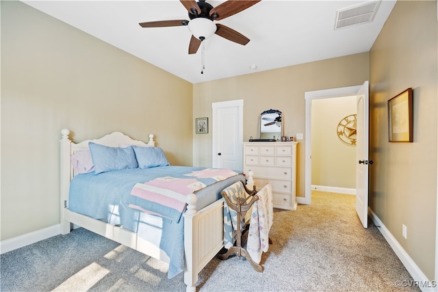 bedroom with light colored carpet, visible vents, a ceiling fan, and baseboards