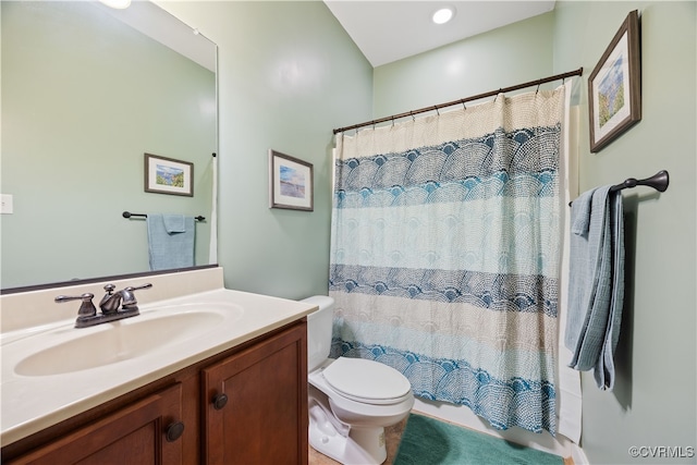 bathroom with a shower with shower curtain, toilet, and vanity