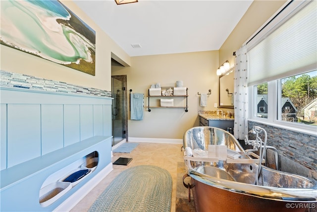 full bath with tile patterned floors, a freestanding tub, vanity, visible vents, and a stall shower