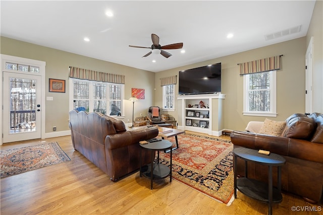 living area with visible vents, baseboards, light wood-type flooring, recessed lighting, and a ceiling fan