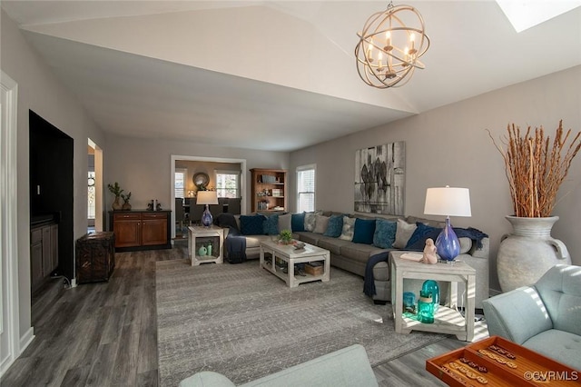 2810 Winterfield Rd, Midlothian, VA 23113 - living room featuring lofted ceiling, dark wood-style flooring, a chandelier, and a skylight