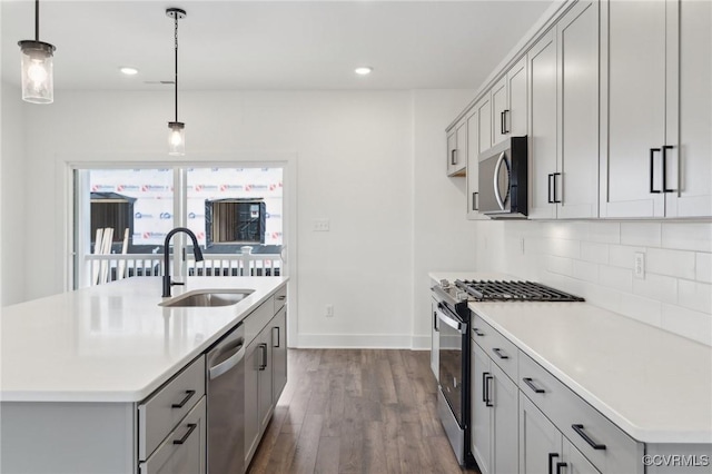12161 Morning Walk, Henrico, VA 23233 - kitchen with appliances with stainless steel finishes, a sink, decorative backsplash, dark wood-style flooring, and light countertops