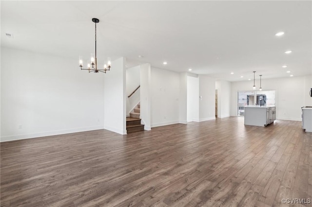 12161 Morning Walk, Henrico, VA 23233 - unfurnished living room featuring recessed lighting, dark wood-type flooring, a chandelier, stairs, and baseboards