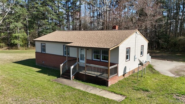 2502 Dry Bread Rd, Emporia, VA 23847 - ranch-style house featuring roof with shingles, a chimney, a front lawn, crawl space, and a porch