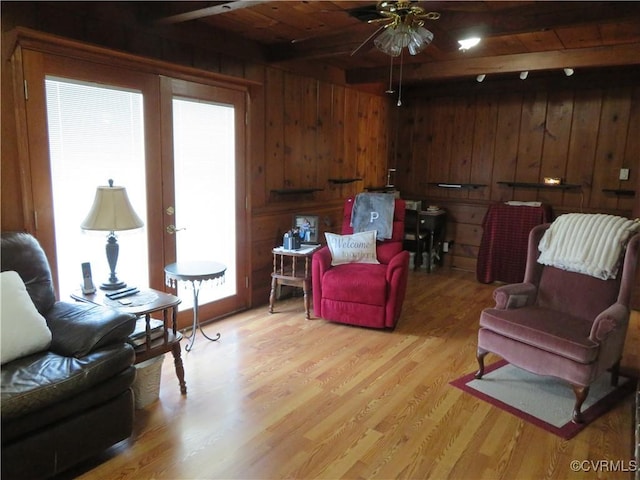 9616 Sunnyside Rd, Mc Kenney, VA 23872 - living area featuring wooden ceiling, a ceiling fan, light wood finished floors, wood walls, and beamed ceiling