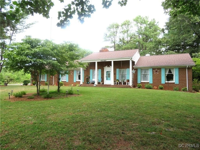 9616 Sunnyside Rd, Mc Kenney, VA 23872 - greek revival inspired property with a chimney, brick siding, a porch, and a front lawn