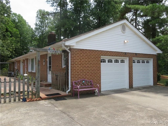 9616 Sunnyside Rd, Mc Kenney, VA 23872 - exterior space featuring brick siding, driveway, and a chimney